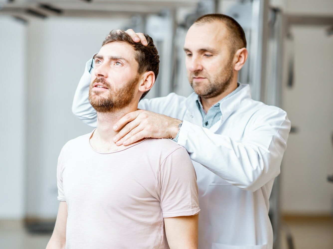 Physiotherapist doing manual treatment to a man