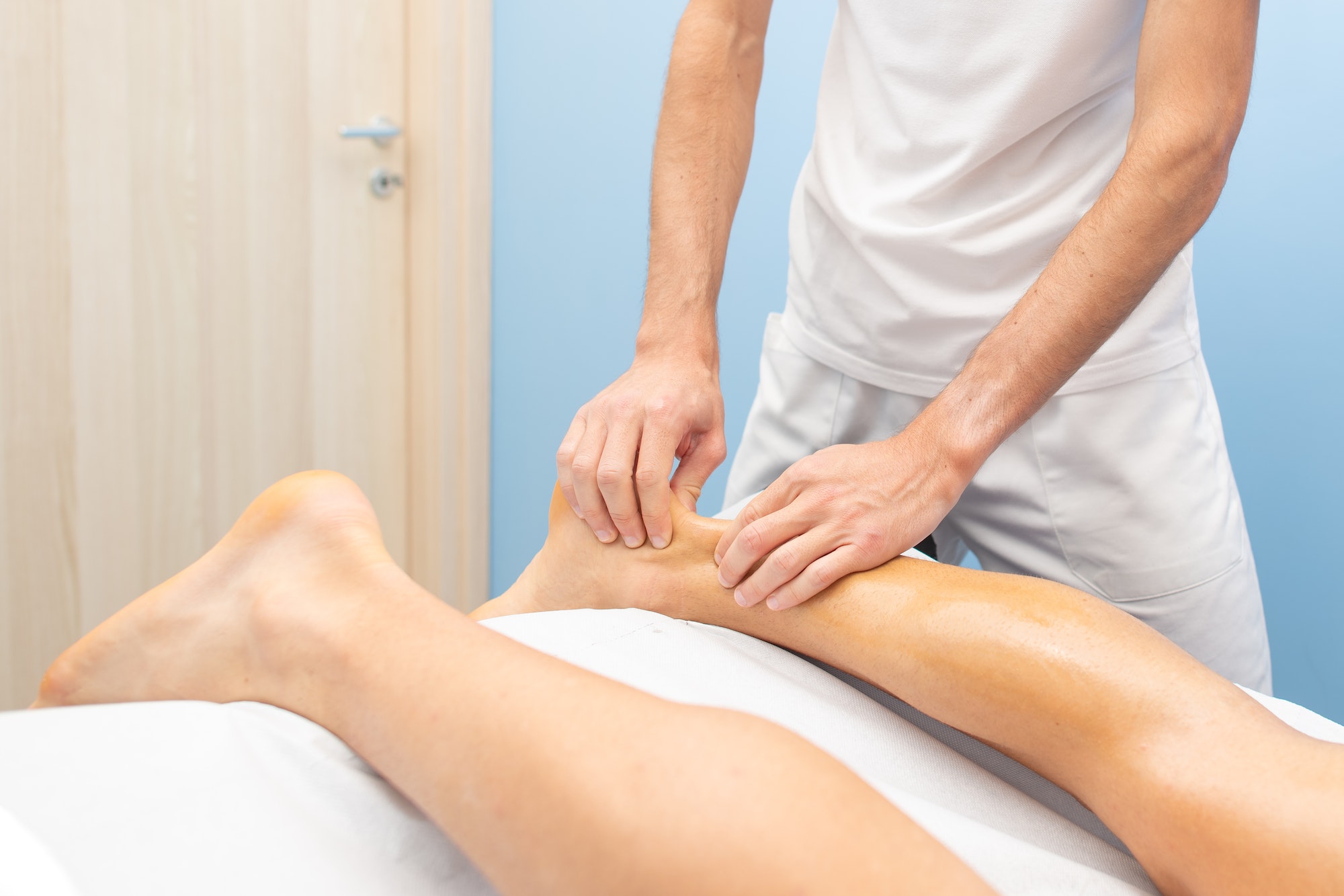 Physiotherapist during an Achilles tendon treatment