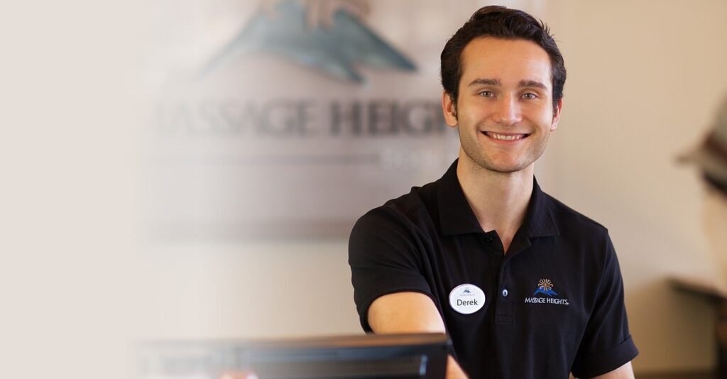 A smiling man in a black shirt poses for the camera, representing collaboration with other health professionals.