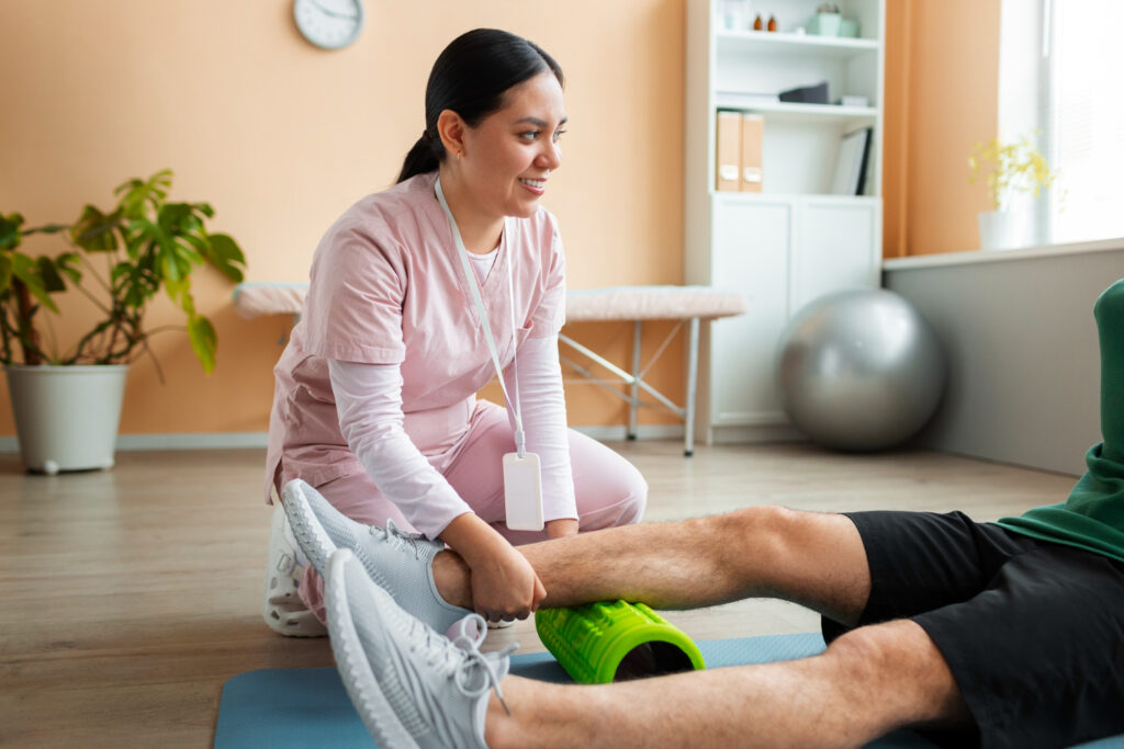 A woman and a man are exercising together on a mat, focusing on safe home-based rehabilitation techniques.