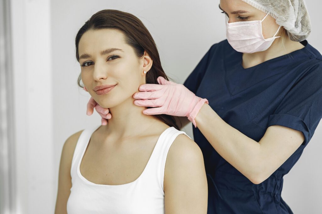 A woman consults a doctor for a neck examination, seeking advice on managing her neck pain effectively.