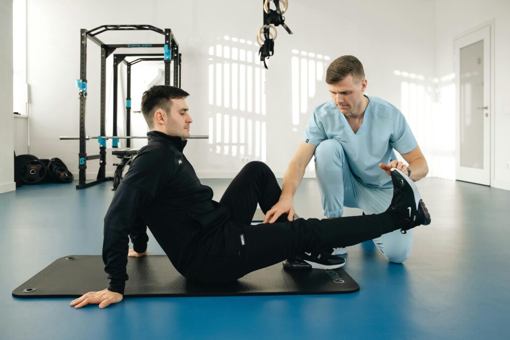 A man exercises with a trainer, focusing on treatment options for plantar fasciitis and calf pain.