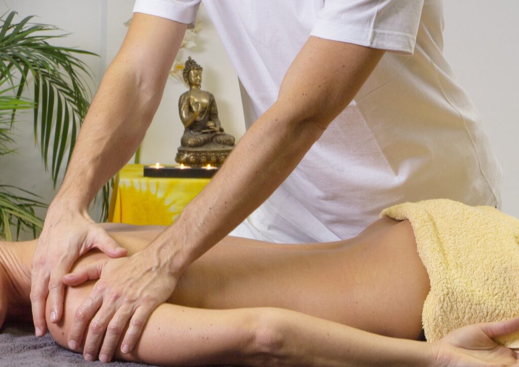 A man receiving a therapeutic massage, exploring alternative treatments like dry needling for pain relief.